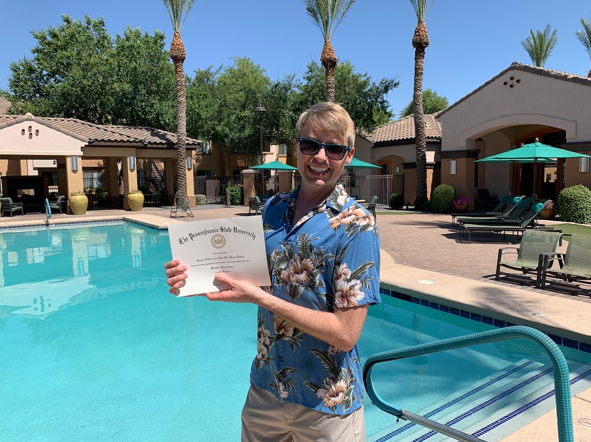 Jesse Daley holding his Penn State Weather Forecasting Certificate